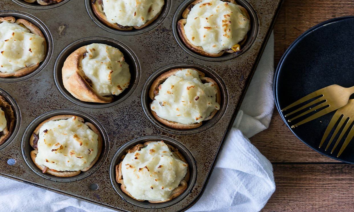 Mini shepherd's pies in a muffin tin