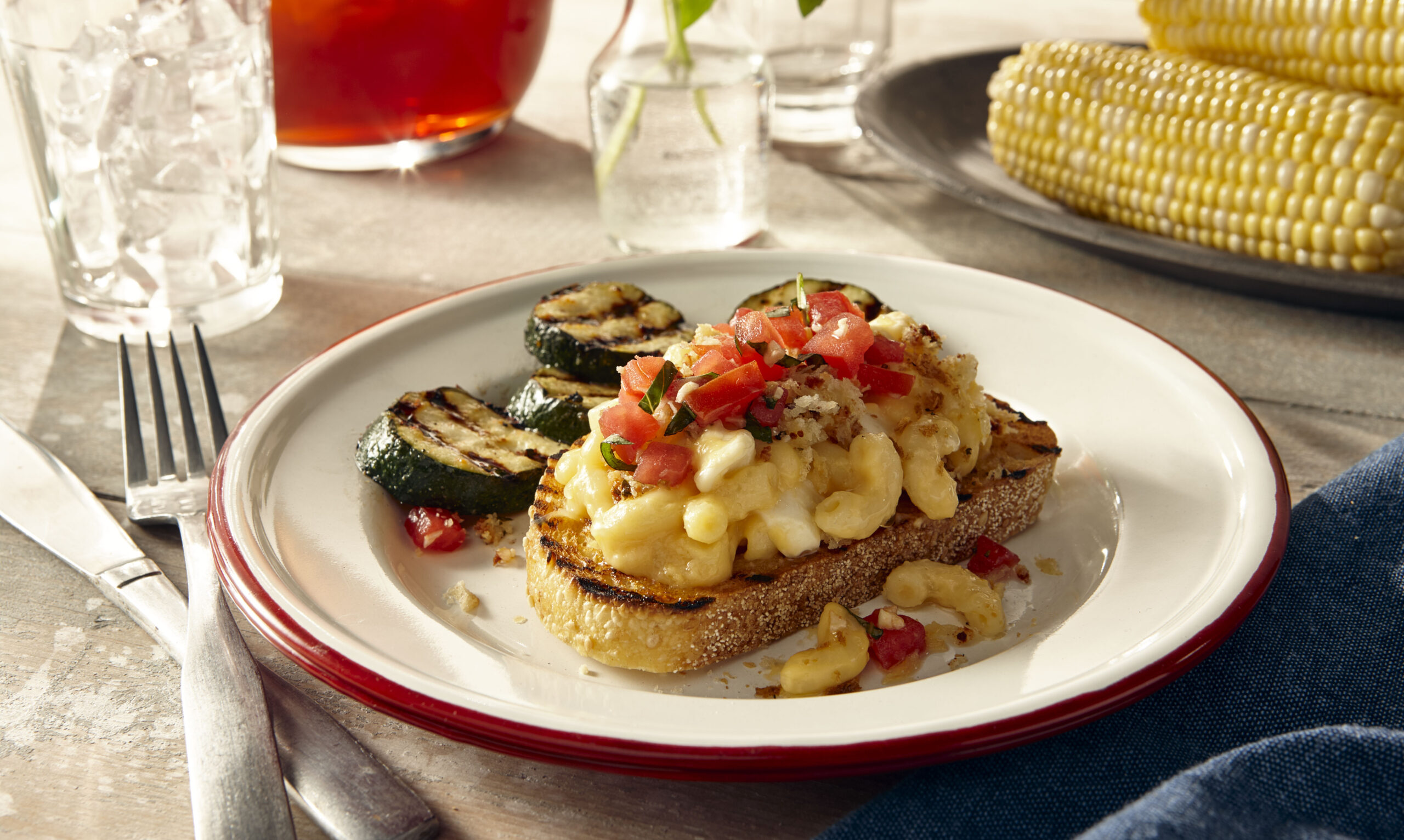 Caprese macaroni and cheese served with grilled zucchini