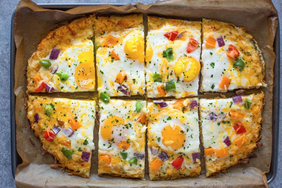 Breakfast pizza with a hash brown crust