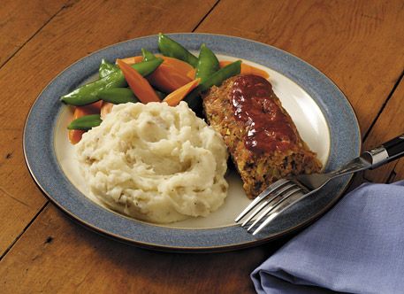 Meat loaf with mashed potatoes and cooked vegetables