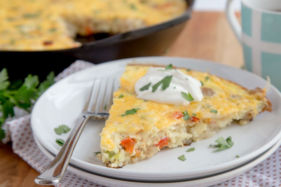 A slice of sausage hash brown frittata