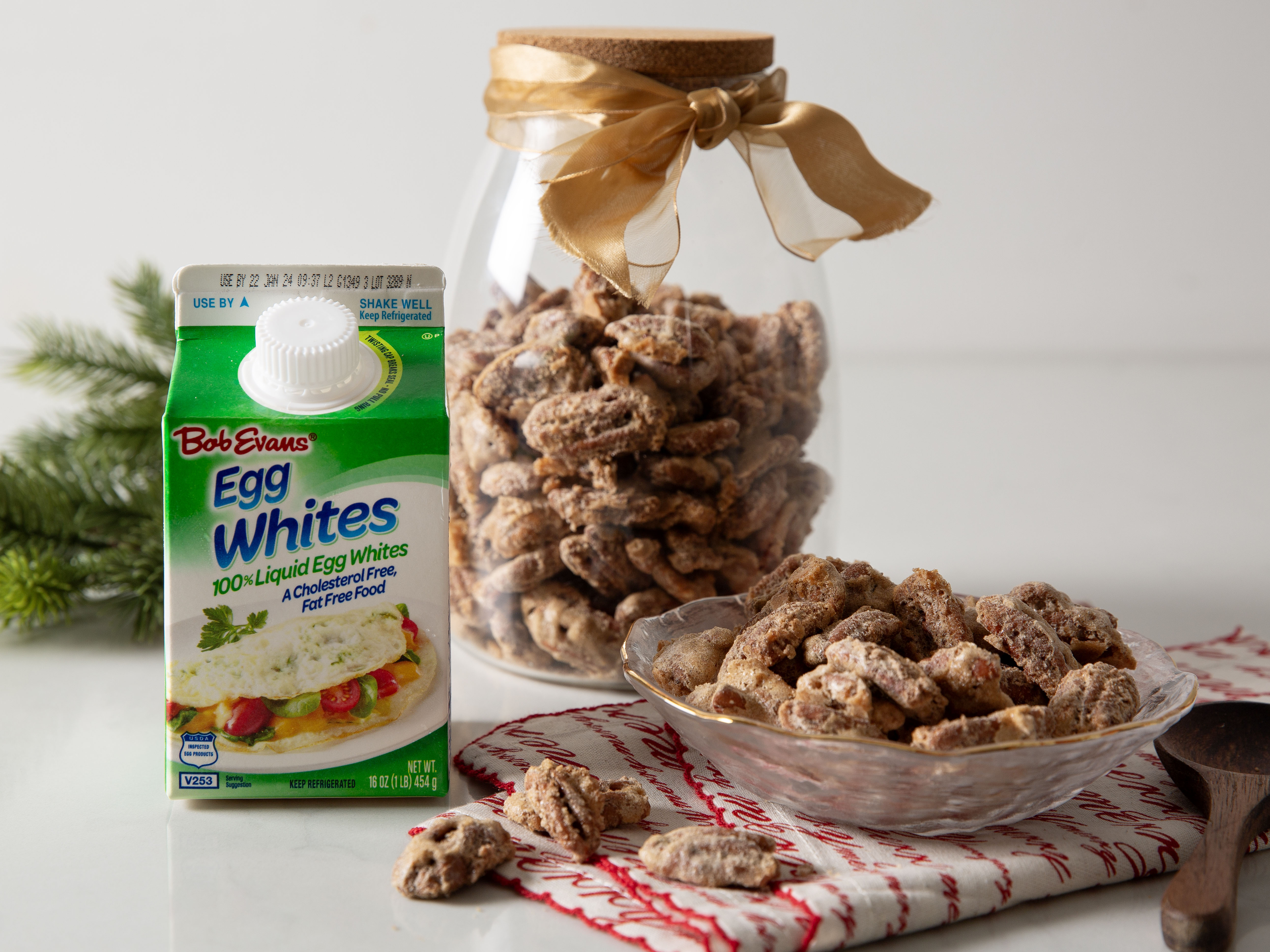 candied pecans in a dish and a jar next to a carton of Bob Evans 100% Liquid Egg Whites