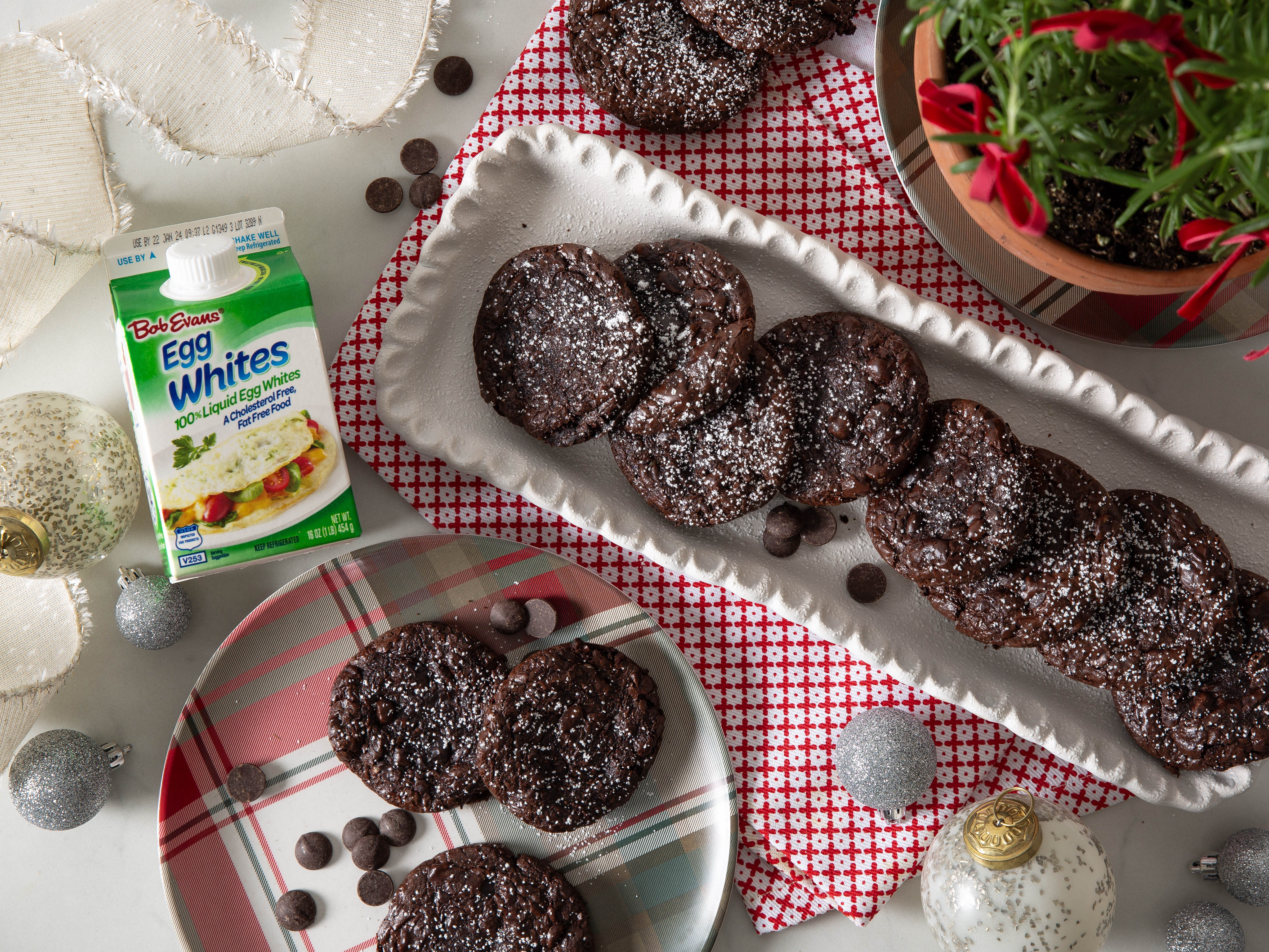 dark chocolate fudgy cookies on platters next to a carton of Bob Evans 100% Liquid Egg Whites