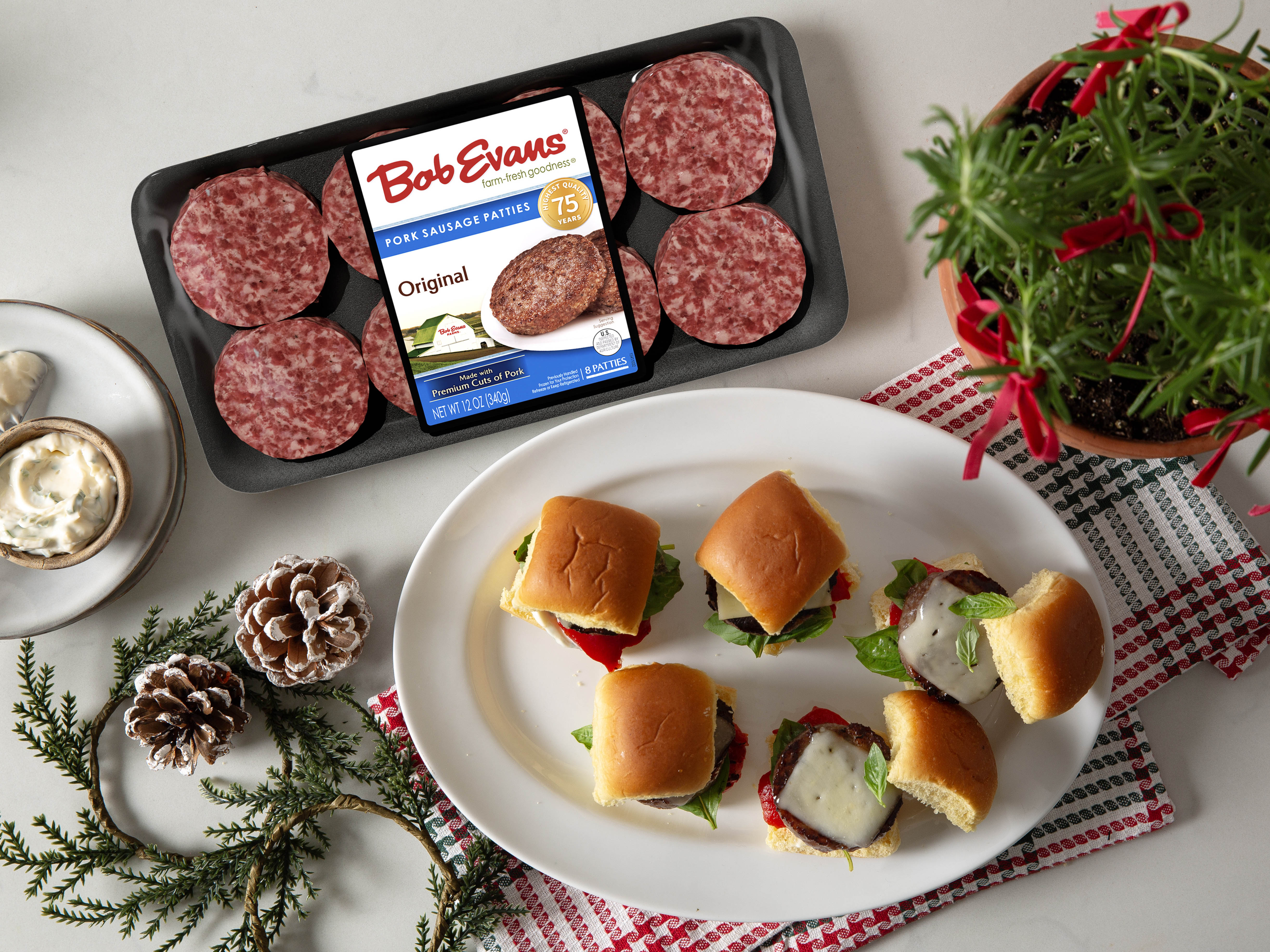 a platter of Italian sliders next to a package of Bob Evans Pork Sausage Patties