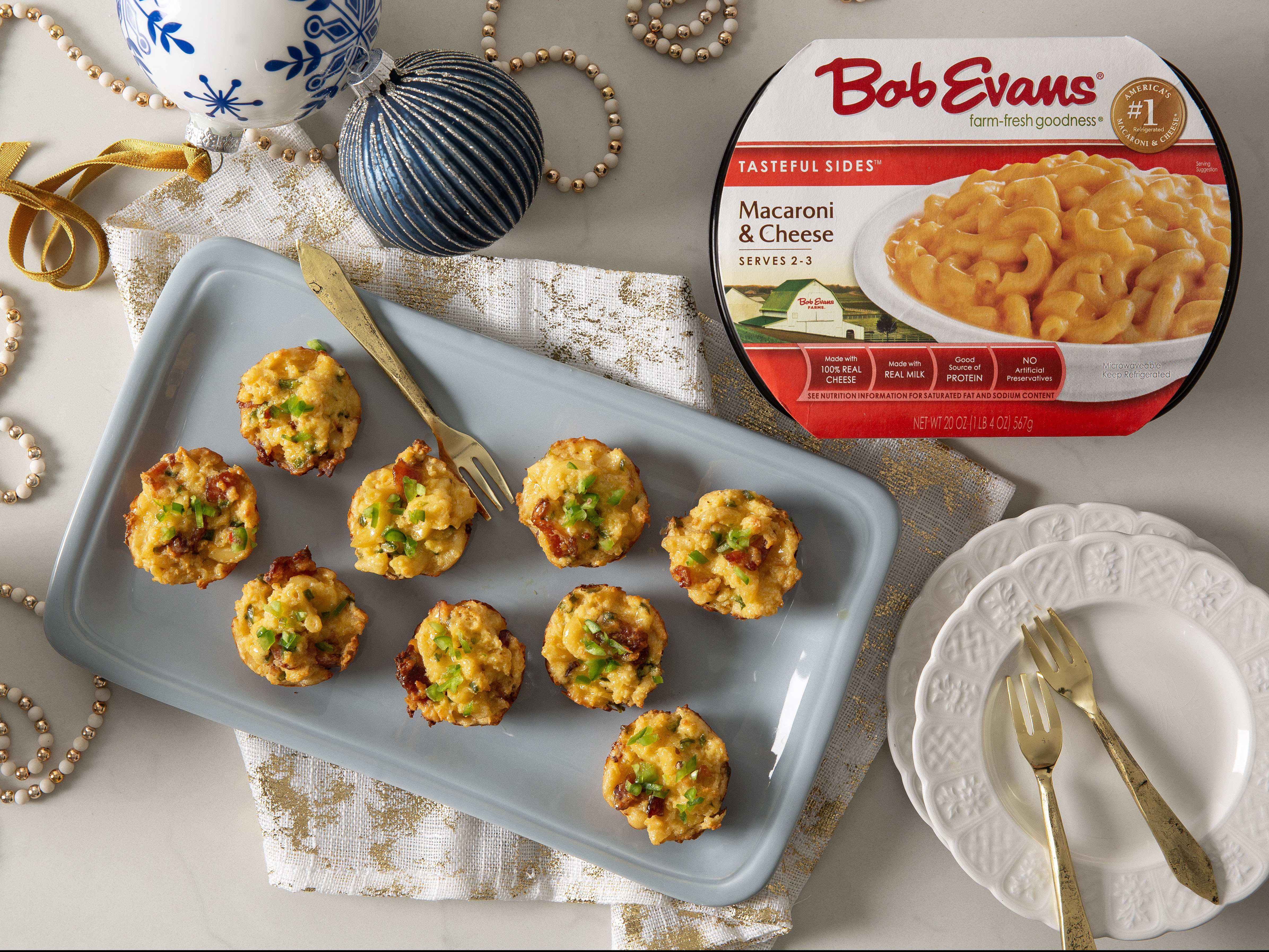 Jalapeño popper macaroni and cheese bites on a platter next to Bob Evans Macaroni & Cheese