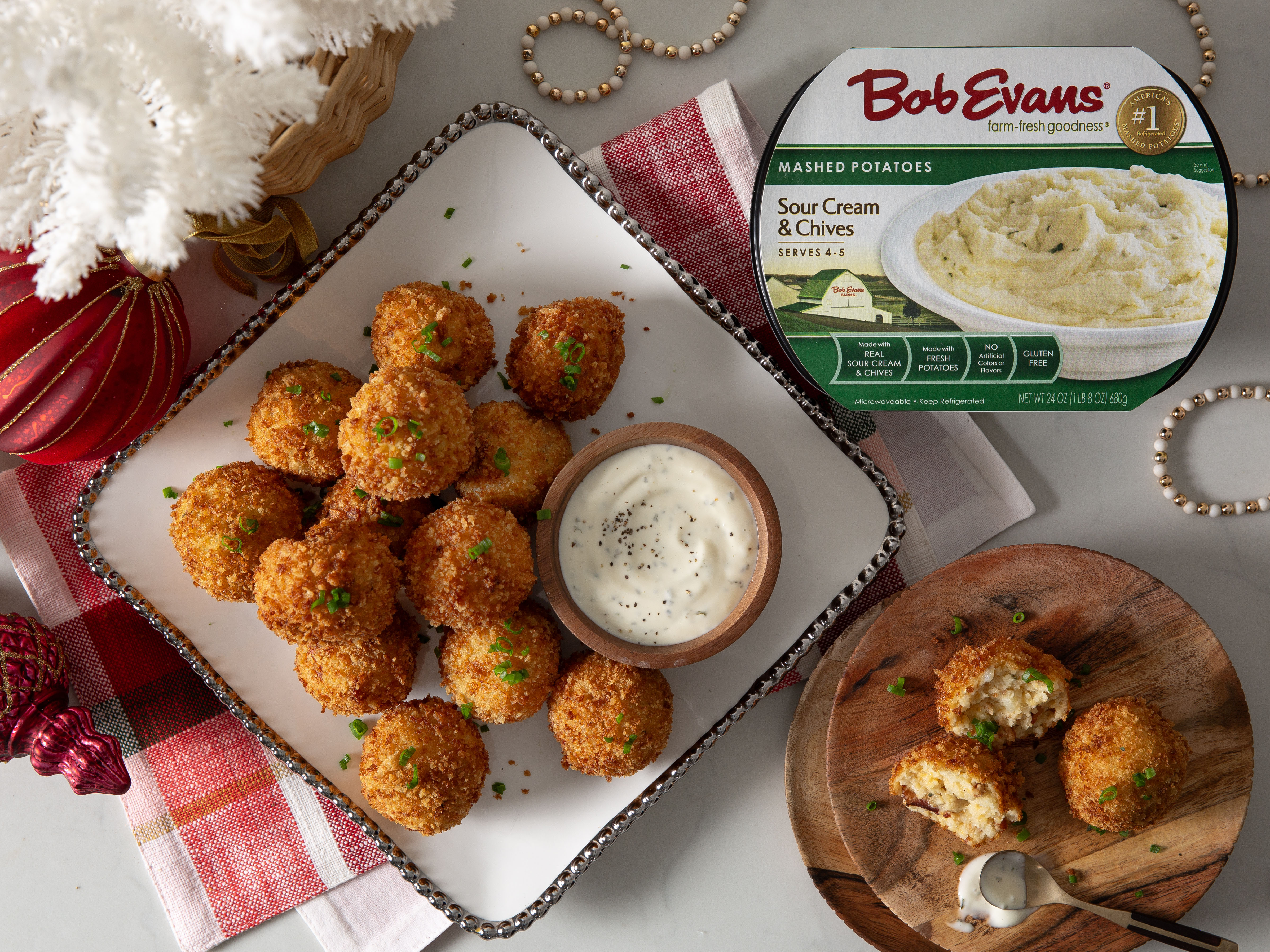 loaded mashed potato balls on a platter with serving sauce and Bob Evans Sour Cream & Chives Mashed Potatoes
