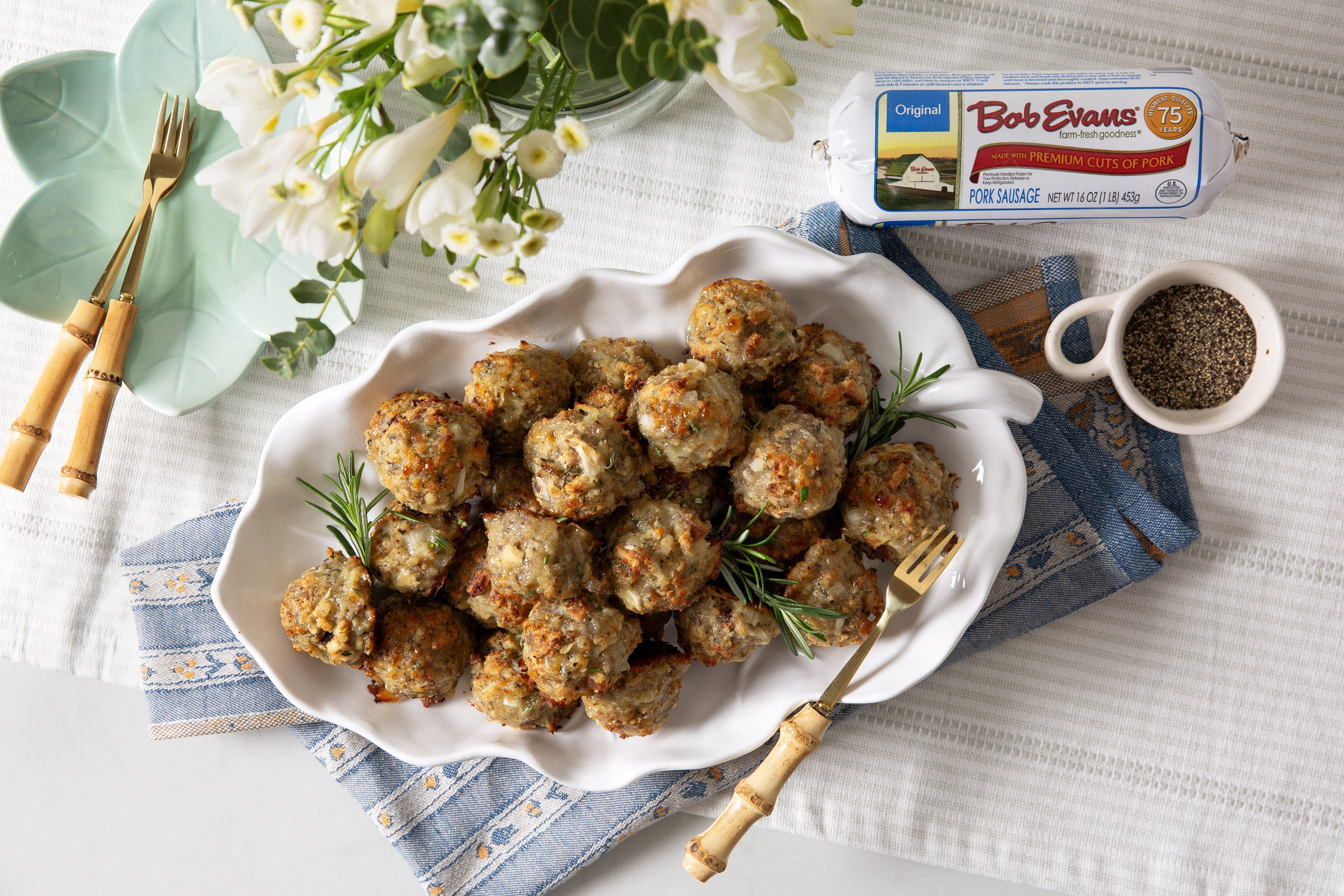 a platter of rosemary sausage balls next to a package of Bob Evans Original Sausage